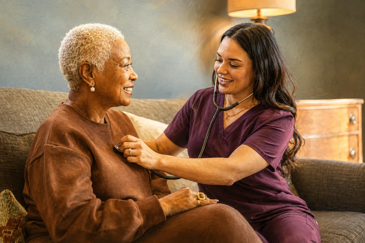Home health nurse listening to an elderly client's heartbeat at home
