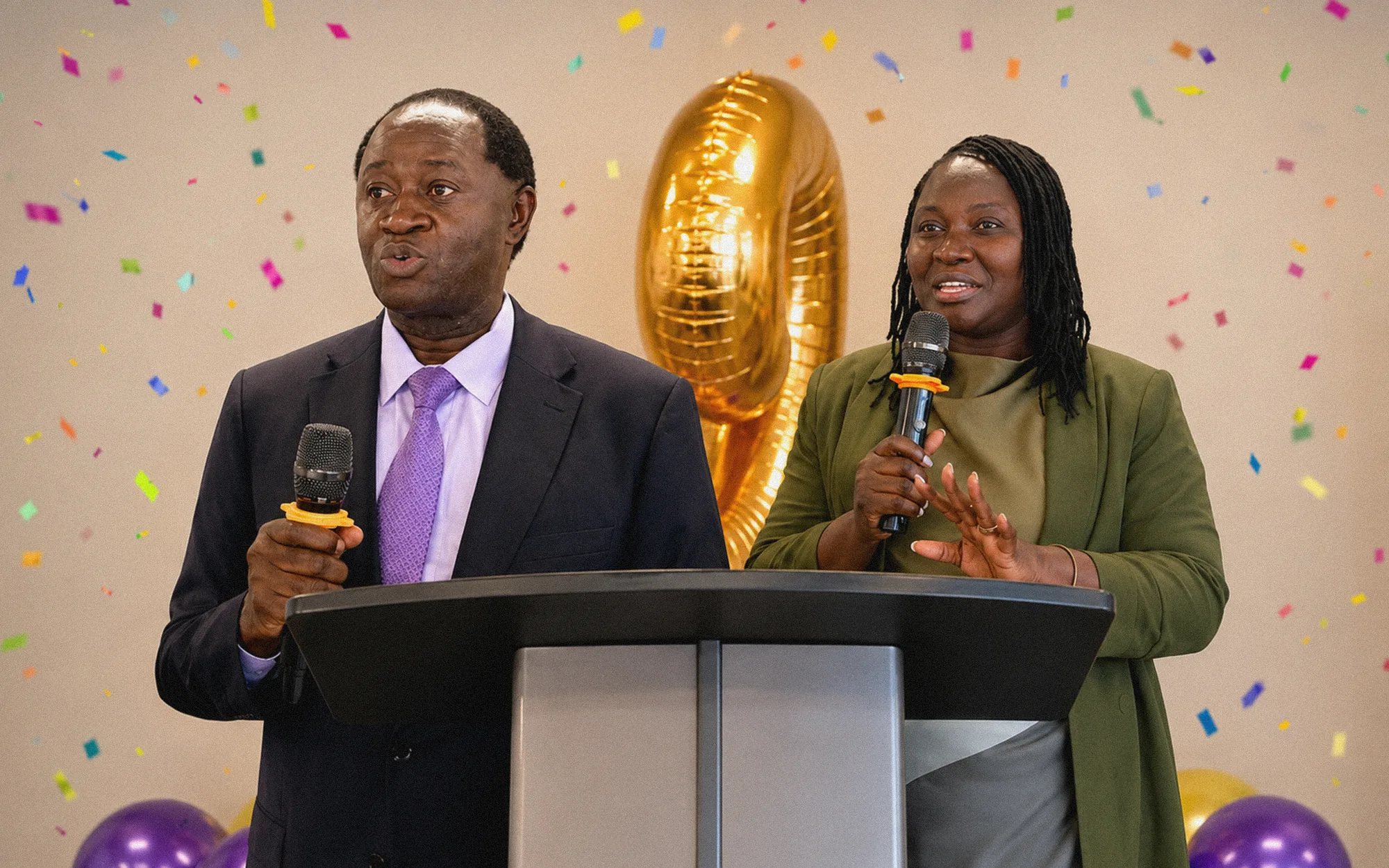 Good Hands leaders speaking at a podium