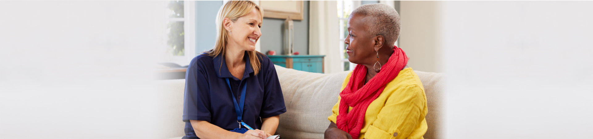 female support worker visits senior woman at home