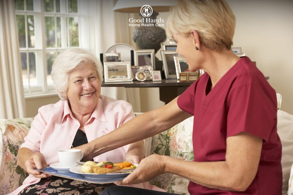 Home care assistant helping elderly client with meal preparation