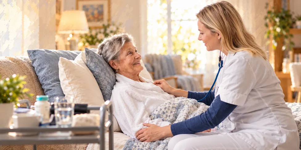 Caregiver helping a client recover at home after surgery
